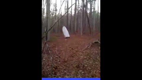 Brent Hulsey carrying boat through the woods