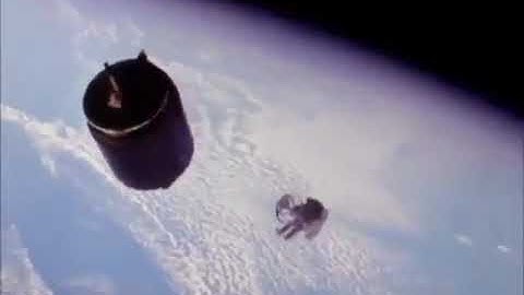 Astronaut Dale Gardner retrieves Westar-6 Satellite during NASA