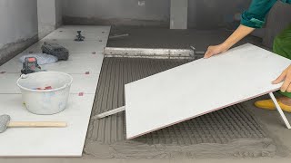 Behind the Scenes of Ceramic Tile Flooring Skilled Hands – Tile Installation Workers at Work
