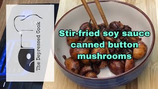 Stir-fried  canned button mushrooms with soy sauce