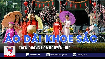 Áo dài khoe sắc trên đường hoa Nguyễn Huệ - VNEWS