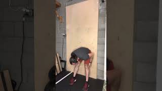 Butt against the wall bent over breathing