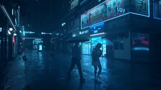 I'm walking in the rain right now, without an umbrella. The sound of rain heard in an alleyway.