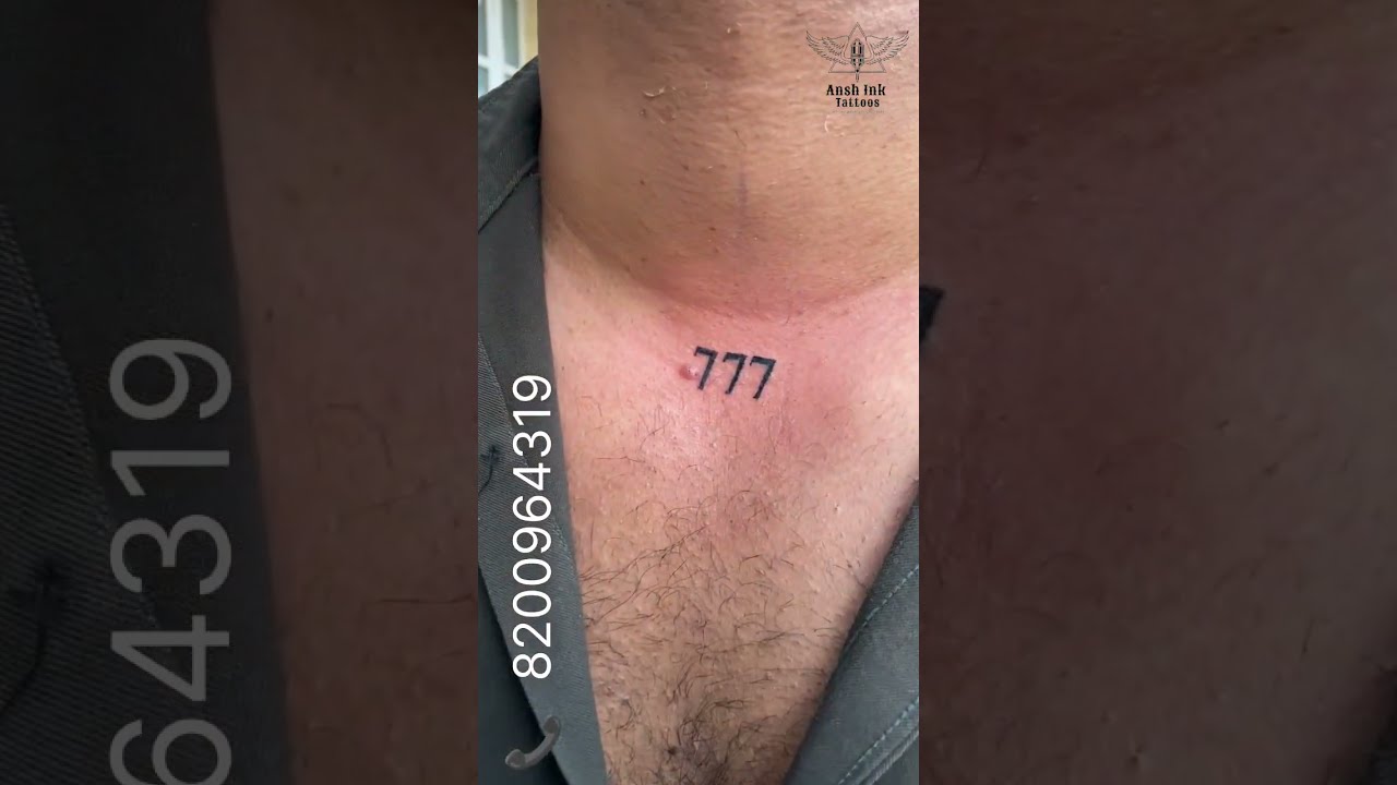 Evil eye and 777 in red ink tattooed on the neck