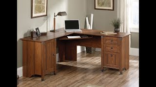 The Sauder Corner Computer Desk is part of the Carson Forge Collection with a nice cherry wood finish and solid construction. The 