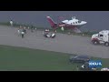 Raw video: Small aircraft down at Hooks Airport, Klein FD says