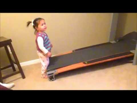 Baby on treadmill.  Pants fall off!