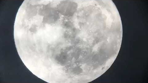 Clouds passing in front of the full moon
