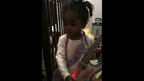 Nadia Davis Playing Guitar