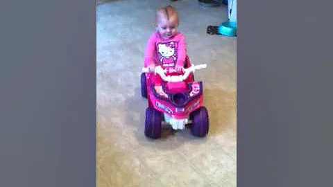 Riding her four wheeler