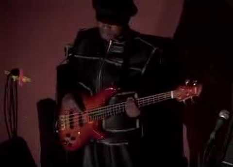 africa's-best-known-bass-player,-ngouma-lokito,-warming-up