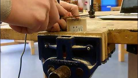 Cutting the tenons for a comb joint.