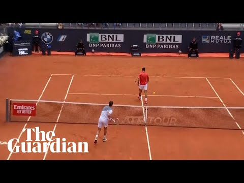 Cameron Norrie smashes ball into Novak Djokovic's legs as world No 1 turns back on net
