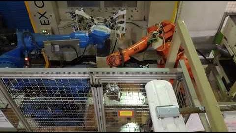 Robot cell with two robots working together