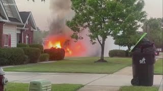 Sanitation truck catches on fire and burns the side of a home in Houston County