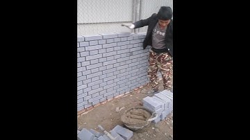 Brick wall making with ingenious skill construction worker