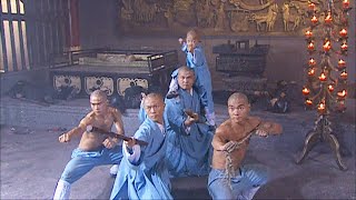 The villain hangs the Shaolin monk up and prepares to drop the big oil boiler.
