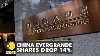 Shares of China Evergrande group slid as much as 14%