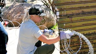 ‘Border Vets’ install razor wire at U.S.Mexico border wall in Jacumba