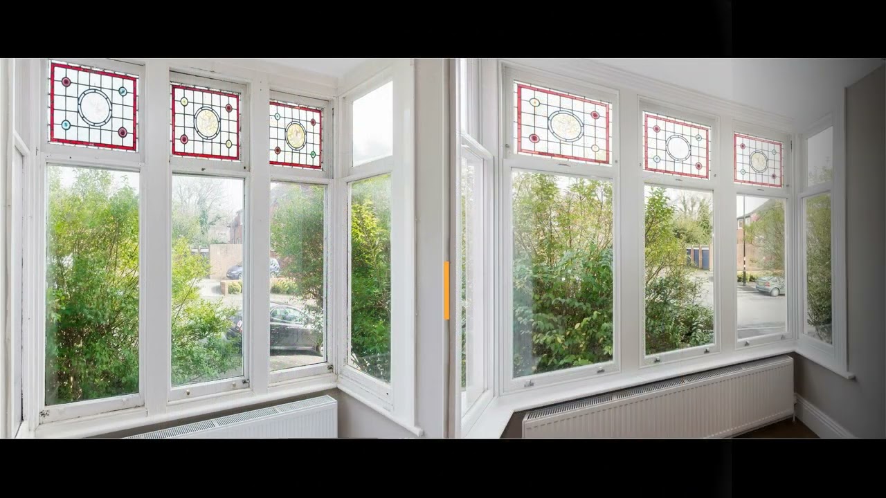 Triple glazing sash windows with stained glass combine functionality and aesthetics.