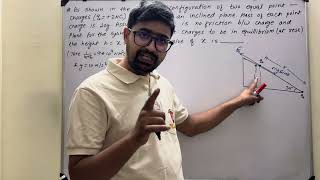 As shown in the figure, configuration of two equal point charges is in equilibrium in a vertical....