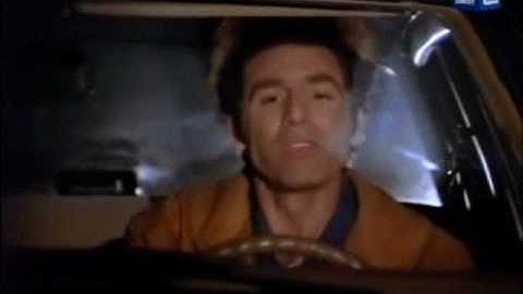 Seinfeld Kramer driving his car and listening to music