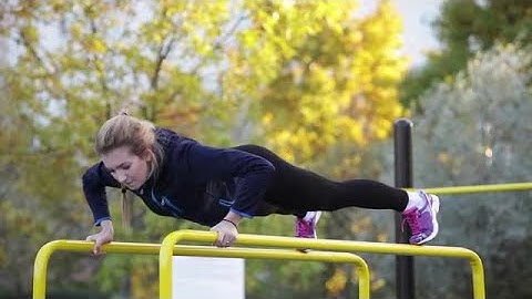 Push-ups On  Parallel Bars Stock Video