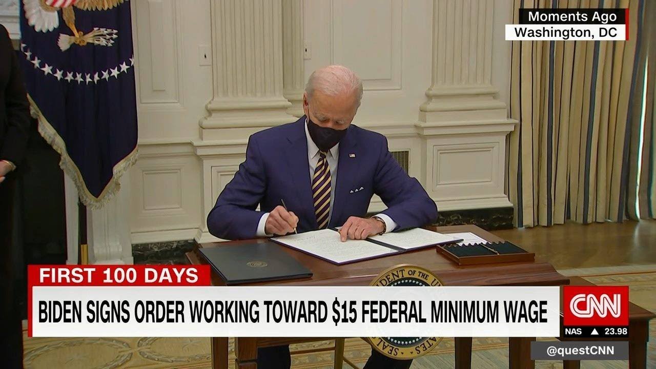 Biden signs executive order to promote $15 federal minimum wage - YouTube