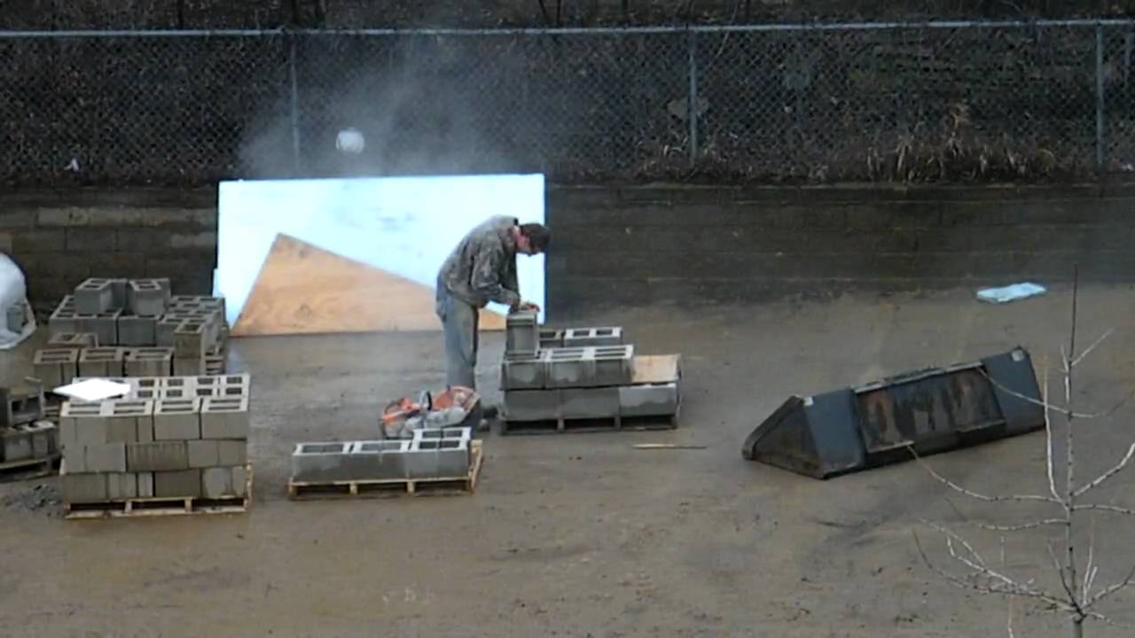 Cutting Cinder (concrete) blocks in half with saw - YouTube