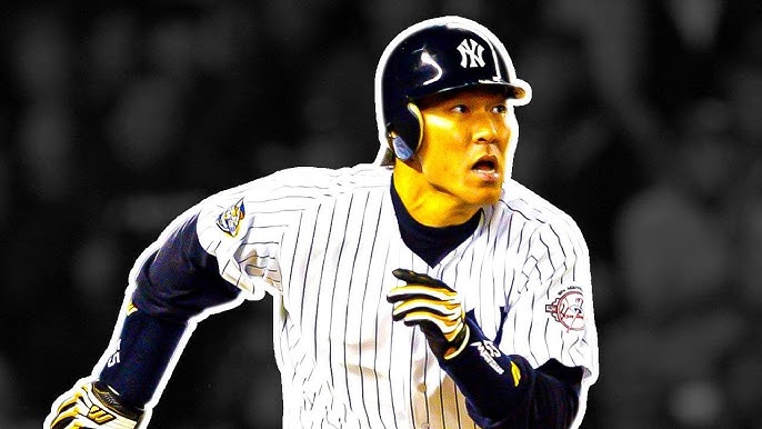 A fan of former New York Yankees outfielder and designated hitter Hideki  Matsui wears a jersey bearing his nickname Godzilla while taking  photographs of batting practice at Yankee stadium before a baseball