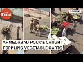 Caught on camera ahmedabad police threaten vendors  topple vegetable carts on road