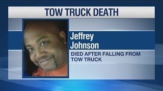 Man dies after falling from tow truck