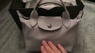 Shop Longchamp Le Pliage Cuir LGP XS Top Handle Bag