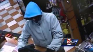 Security footage shows man pull knife on clerk, steal cash register