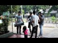 Anarchic street musicians jumping through traffic in Jakarta