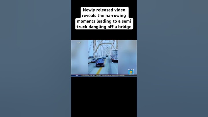 Newly released video reveals the harrowing moments leading to a semi truck dangling off a bridge!