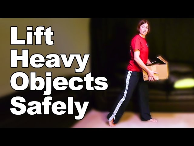 How can you keep your lower back safe while lifting heavy objects