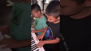 Gio and Leo Playing piano