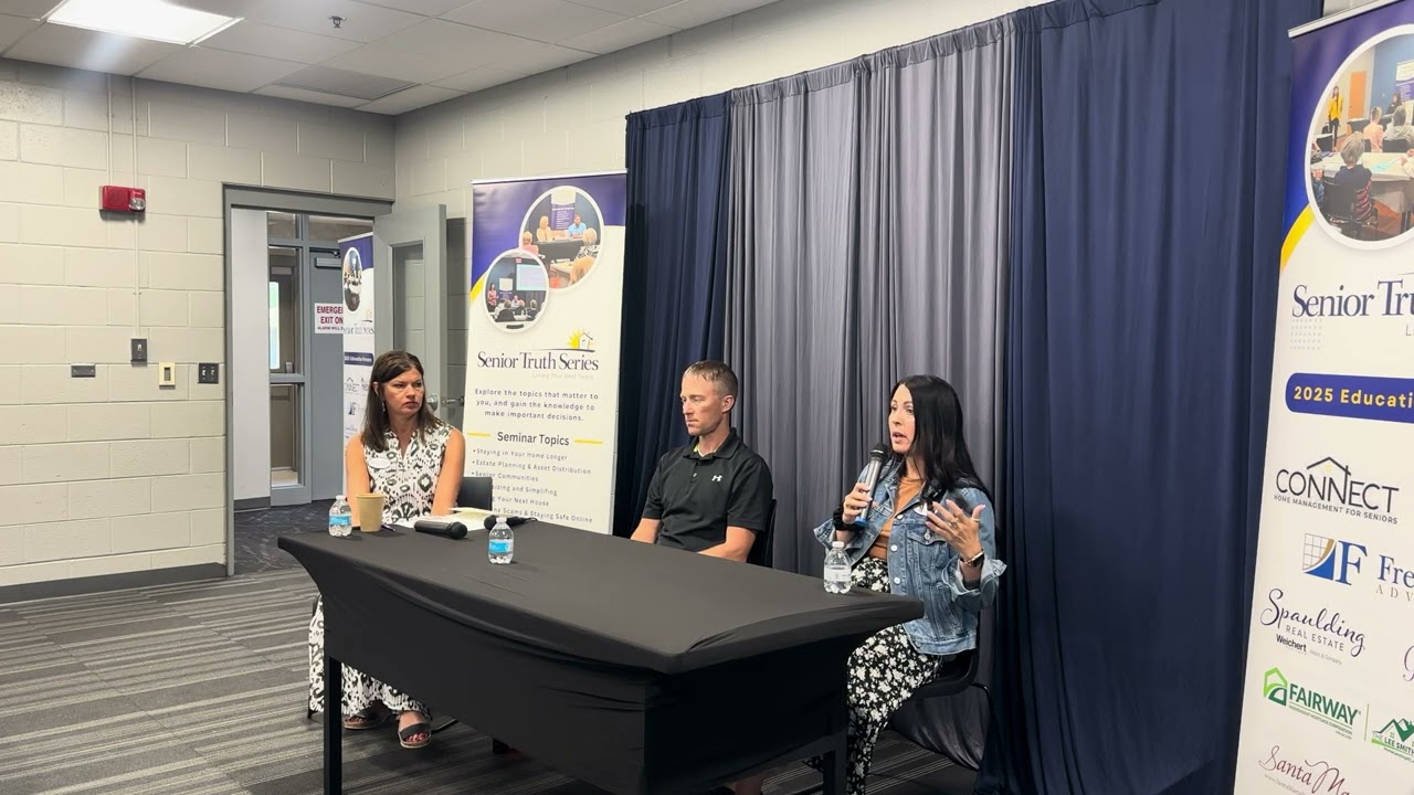 Julie Spaulding sitting with panelists