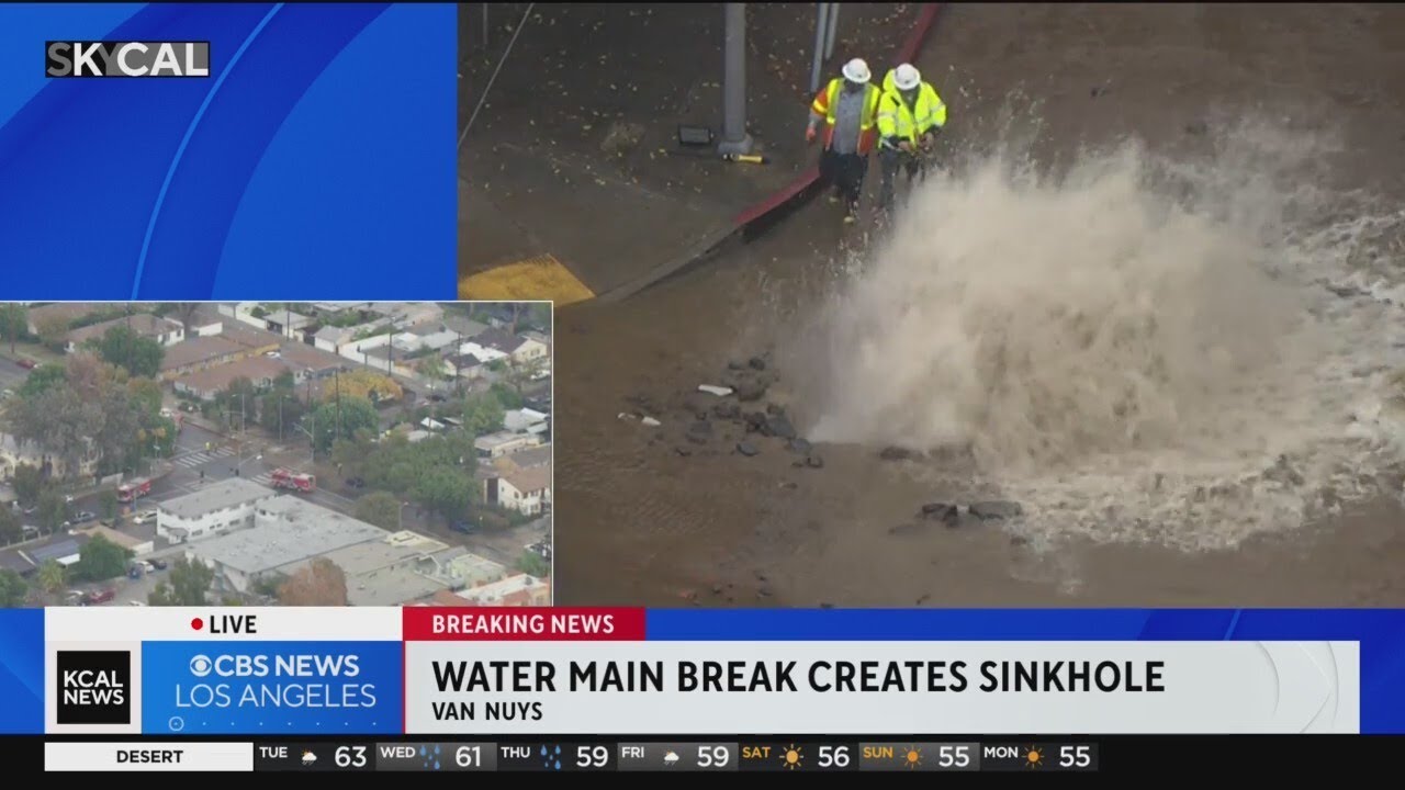Water main break creates sinkhole at Van Nuys intersection - YouTube