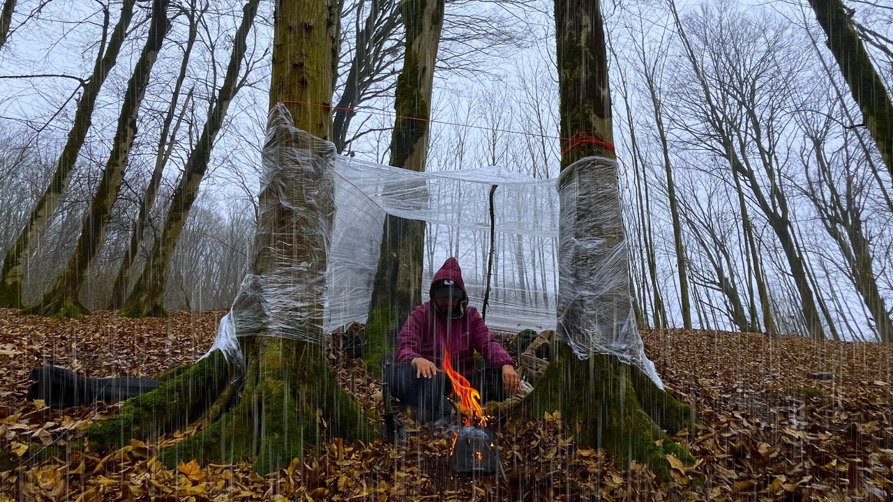 Building a Waterproof Shelter with Plastic Wrap in Heavy Rain ...