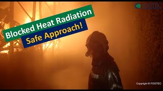 FOGTEC - Fire Fighter right next to full scale fire scenario with activated water mist system!