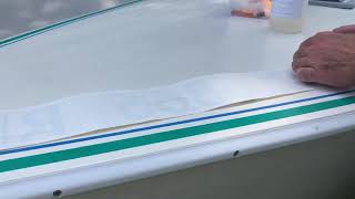 Apply boat registration number stickers using the wet method