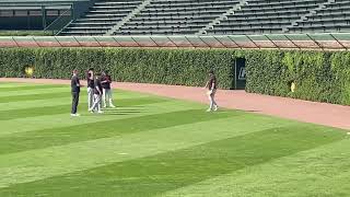 Casey Mize tests his hamstring in the outfield at Wrigley Field