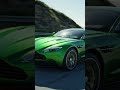 green color astarn martin on road
