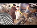 The Process of Large Iron Pipes Manufacturing by Gigantic Machines