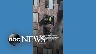 Firefighters rescue person from burning New York high-rise building