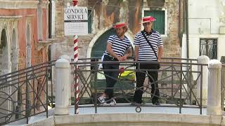 Gondoliers in Venice, Italy