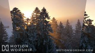 Winter Sunrise Warm Rays HD Loop by Motion Worship
Download at https://www.MotionWorship.com - A camera slowly pans across snowy pine trees with a golden sunrise beaming through the branches in this breathtaking background. Winter Sunrise Warm Rays HD Loop by Motion Worship