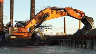 Backhoe dredger ”Simson” in operation for construction of the work harbour